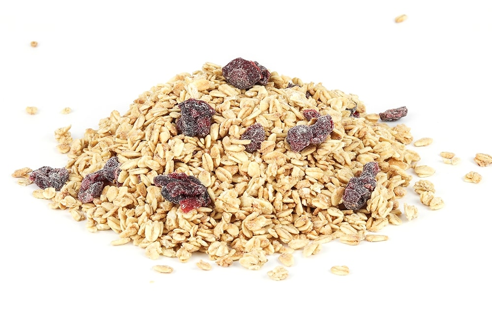 A Pile Of Berry Granola On A White Background