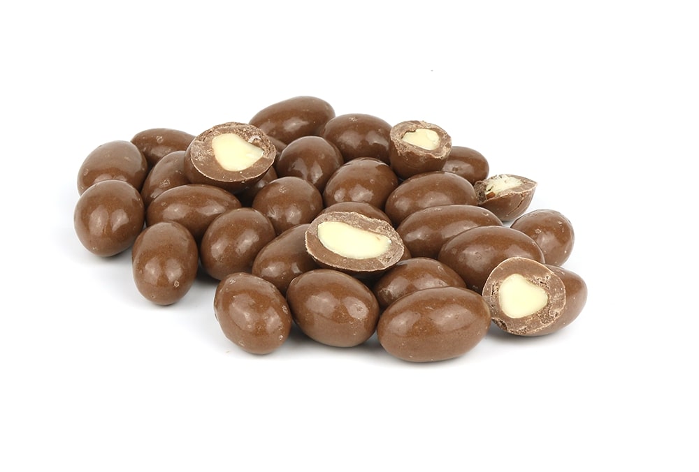 A pile of chocolate covered almonds and Milk Chocolate Brazils on a white background.
