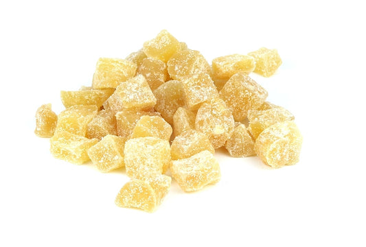 A Pile Of Crystalised Ginger On A White Background