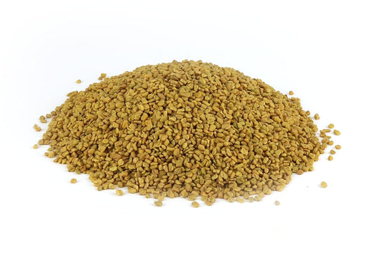 A Pile Of Fenugreek Seeds On A White Background