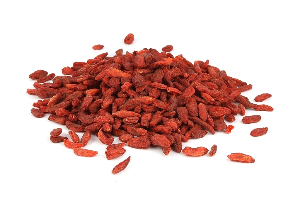 A Pile Of Goji Berries On A White Background