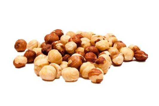 A pile of Hazelnuts on a white background