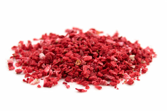 A Pile Of Freeze dried strawberry (Pieces) On A White Background