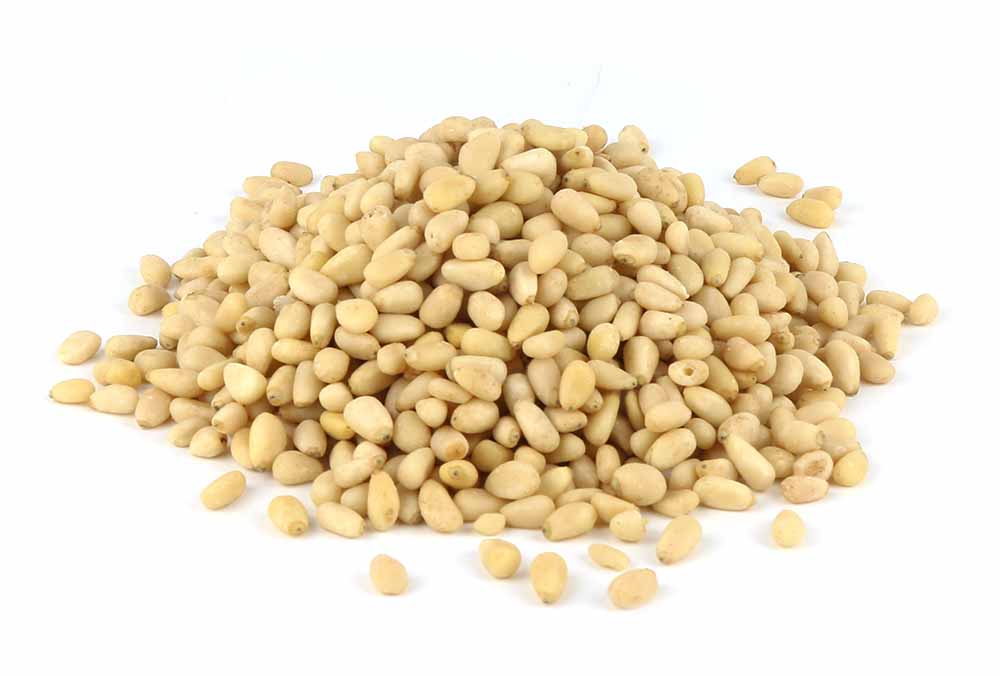 A Pile Of Pine Nuts On A White Background