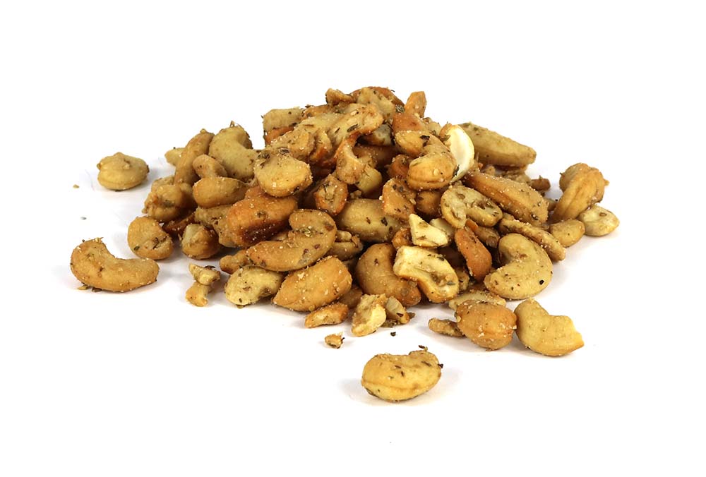 A Pile Of Garlic & Herb Cashew Nuts On White Background