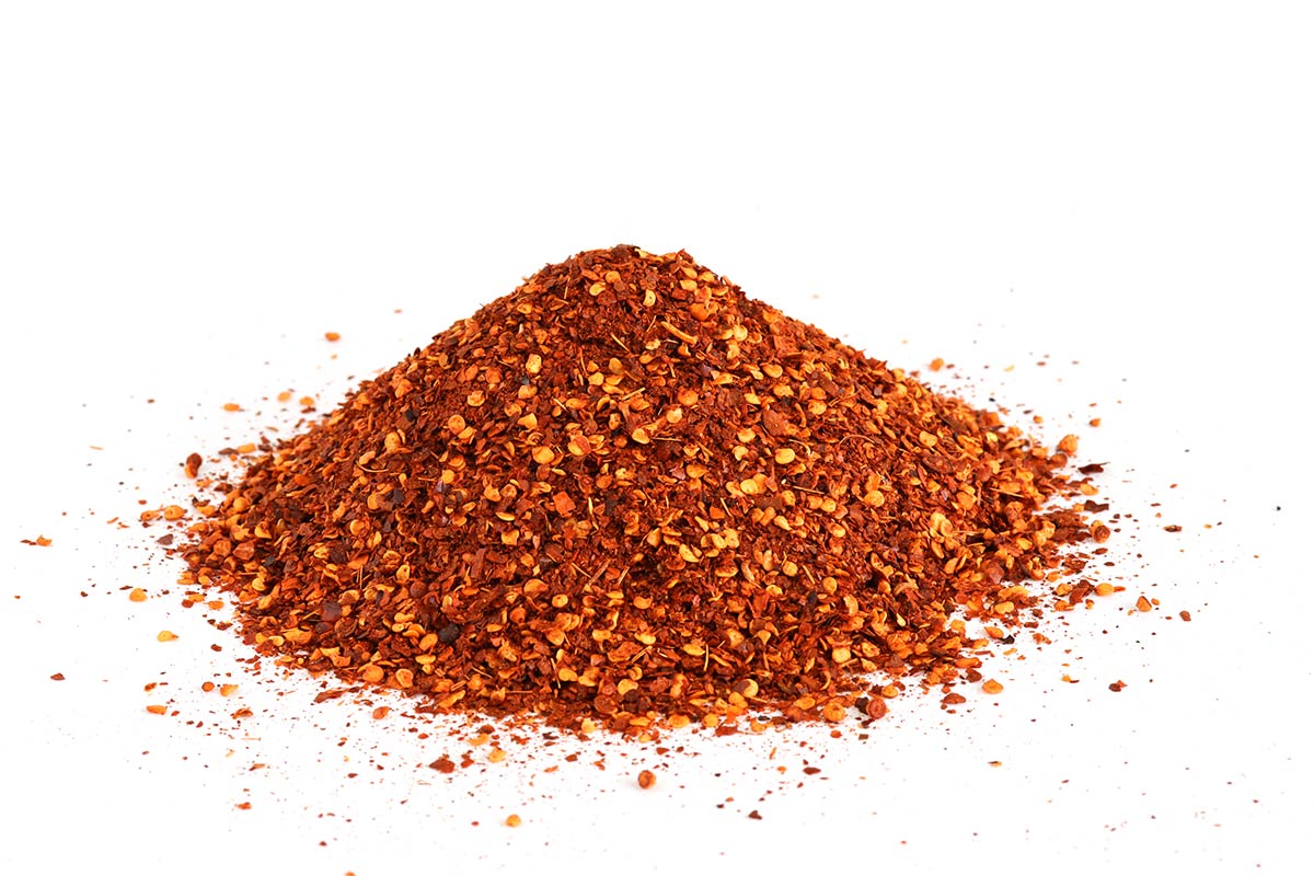 Crushed Chillies On A White Background