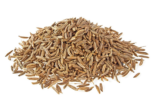 A Pile Of Cumin Seeds On A White Background