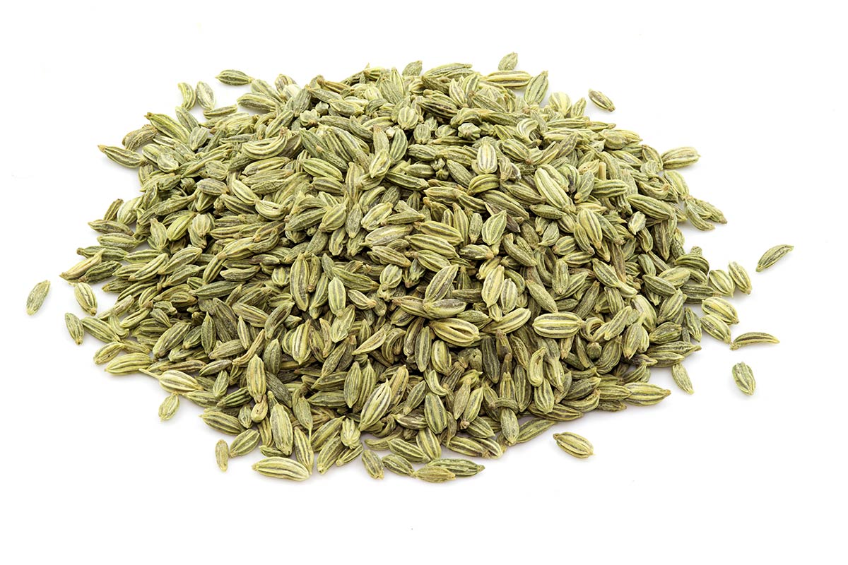 A Pile Of Fennel Seeds On A White Background