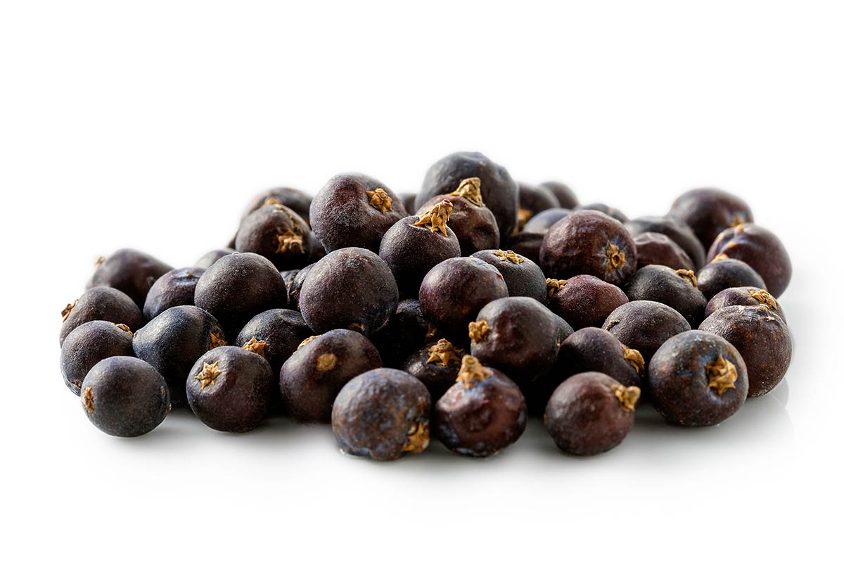 A Pile Of Juniper Berries On A White Background