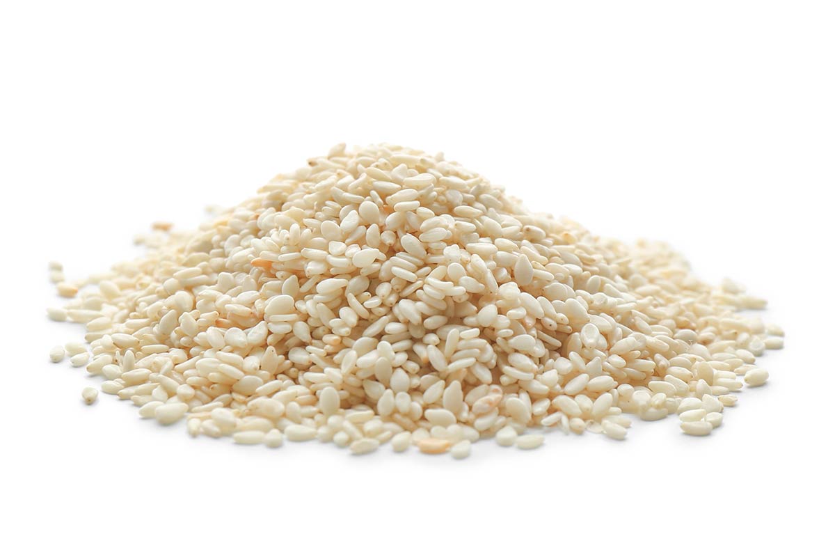 A Pile of Sesame Seeds On A White Background