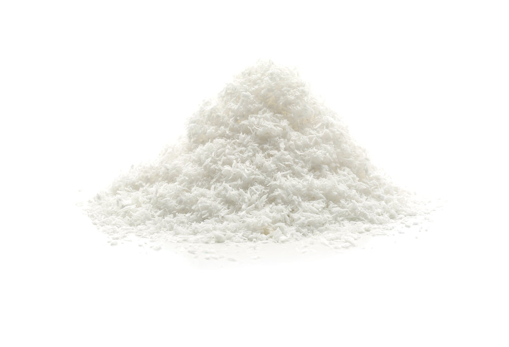 A Pile Of Desiccated Coconut On A White Background