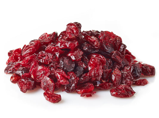 A Pile Of Dried Cranberries On A White Background