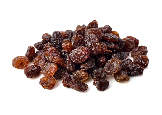 A Pile Of Raisins On A White Background